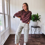 Mineral washed light olive denim barrel pants with carpenter design, side pockets and button and zipper closure with elastic back waist.