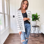 Soft, popcorn textured white cardigan with black striping and side pockets.