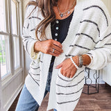 Soft, popcorn textured white cardigan with black striping and side pockets.