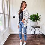 High rise stretch medium wash denim in a mom jean style with distressing at the knees and ankles, skinny design.