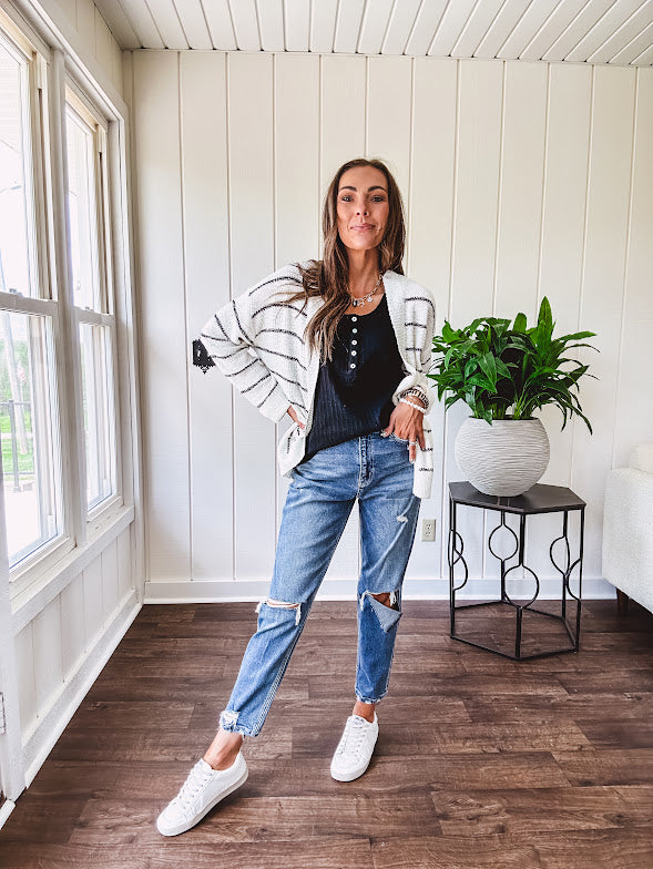 Soft, popcorn textured white cardigan with black striping and side pockets.