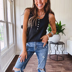Soft black ribbed textured round neck wide strap tank with 1/4 abalone buttons down the front and relaxed fit.