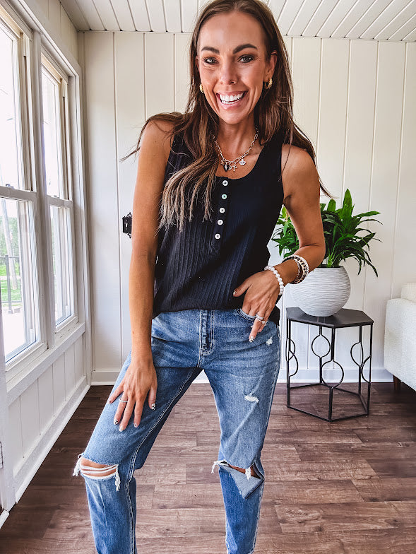 Soft black ribbed textured round neck wide strap tank with 1/4 abalone buttons down the front and relaxed fit.