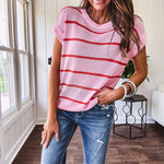 Lightweight woven sweater in blush pink with orange stripes, capped sleeves and a relaxed fit.