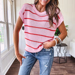 Lightweight woven sweater in blush pink with orange stripes, capped sleeves and a relaxed fit.