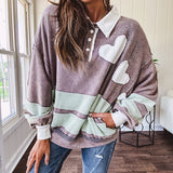 Washed terry knit slate grey pullover with white collar, and 3 snap button placket and heart patchwork and embroidery with Rugby style waffle texture striping detail and pockets.