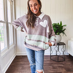 Washed terry knit slate grey pullover with white collar, and 3 snap button placket and heart patchwork and embroidery with Rugby style waffle texture striping detail and pockets.