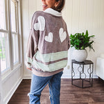 Washed terry knit slate grey pullover with white collar, and 3 snap button placket and heart patchwork and embroidery with Rugby style waffle texture striping detail and pockets.