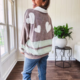 Washed terry knit slate grey pullover with white collar, and 3 snap button placket and heart patchwork and embroidery with Rugby style waffle texture striping detail and pockets.