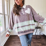 Washed terry knit slate grey pullover with white collar, and 3 snap button placket and heart patchwork and embroidery with Rugby style waffle texture striping detail and pockets.