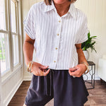 Thin, flowy black shorts with elastic drawstring waist and double layer hemline.