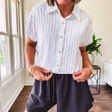 Thin, flowy black shorts with elastic drawstring waist and double layer hemline.