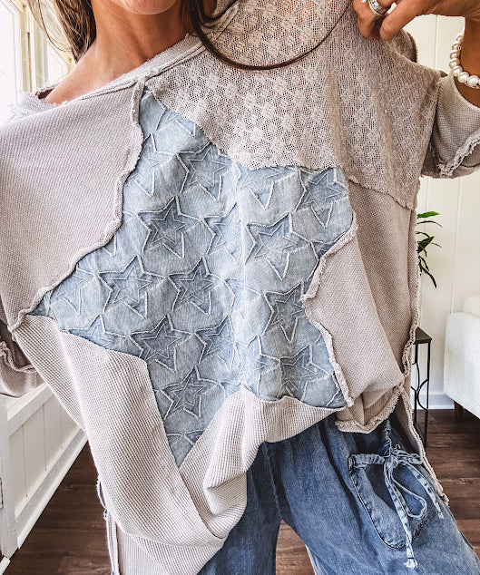 Oversized taupe waffle textured 3/4 sleeve top with lace detail and a denim star patch on the front with exposed seams.
