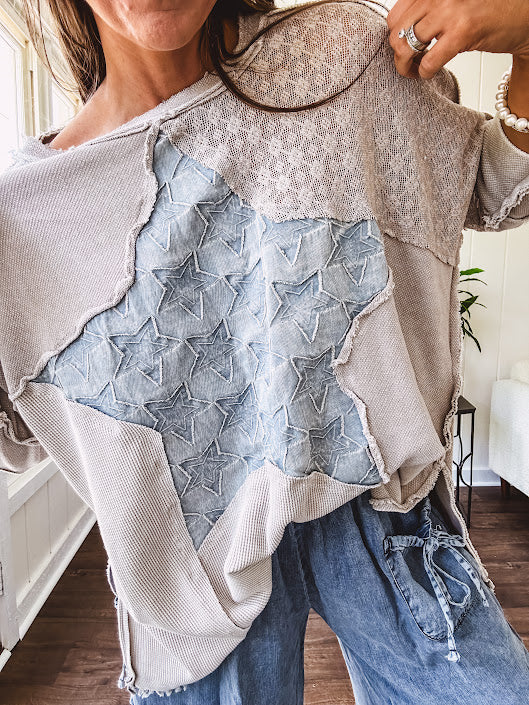 Oversized taupe waffle textured 3/4 sleeve top with lace detail and a denim star patch on the front with exposed seams.