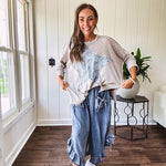 Oversized taupe waffle textured 3/4 sleeve top with lace detail and a denim star patch on the front with exposed seams.