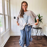 Oversized taupe waffle textured 3/4 sleeve top with lace detail and a denim star patch on the front with exposed seams.