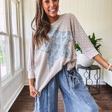 Oversized taupe waffle textured 3/4 sleeve top with lace detail and a denim star patch on the front with exposed seams.