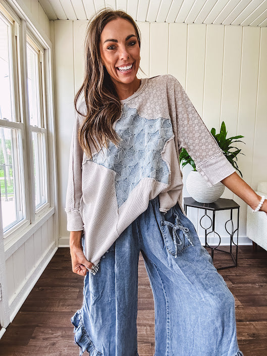 Oversized taupe waffle textured 3/4 sleeve top with lace detail and a denim star patch on the front with exposed seams.