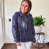 Navy gauze button down long sleeved top featuring a ruffled hem, front pocket and matching navy paisley scarf tie.