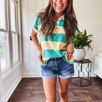 Oversized butter yellow and washed green wide striped Rugby style top with white collar and 1/4 metal button placket and cuffs.