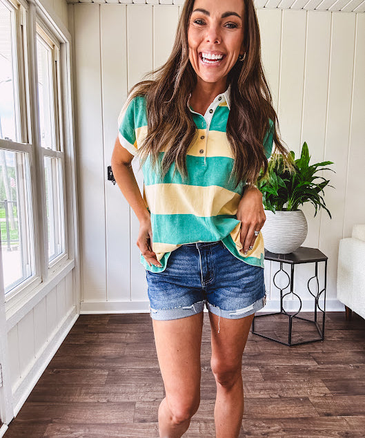 Oversized butter yellow and washed green wide striped Rugby style top with white collar and 1/4 metal button placket and cuffs.