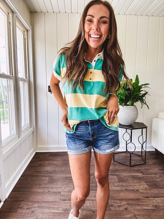 Oversized butter yellow and washed green wide striped Rugby style top with white collar and 1/4 metal button placket and cuffs.