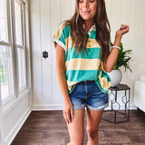Oversized butter yellow and washed green wide striped Rugby style top with white collar and 1/4 metal button placket and cuffs.