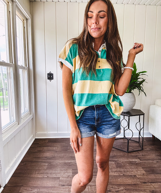 Oversized butter yellow and washed green wide striped Rugby style top with white collar and 1/4 metal button placket and cuffs.