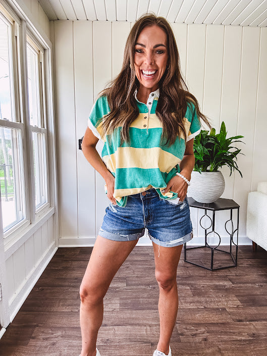Oversized butter yellow and washed green wide striped Rugby style top with white collar and 1/4 metal button placket and cuffs.