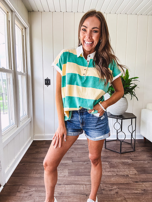 Oversized butter yellow and washed green wide striped Rugby style top with white collar and 1/4 metal button placket and cuffs.