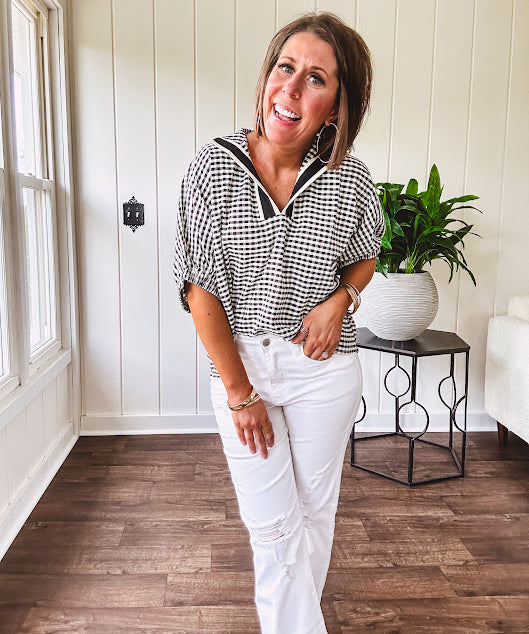 Lightweight black and white gingham dolman style top with mock neck, black and white striped V neck and elastic short sleeves.