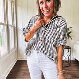 Lightweight black and white gingham dolman style top with mock neck, black and white striped V neck and elastic short sleeves.