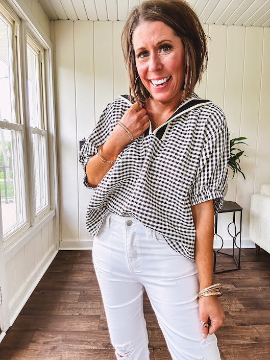 Lightweight black and white gingham dolman style top with mock neck, black and white striped V neck and elastic short sleeves.