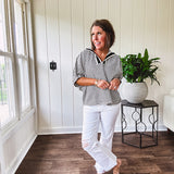 Lightweight black and white gingham dolman style top with mock neck, black and white striped V neck and elastic short sleeves.