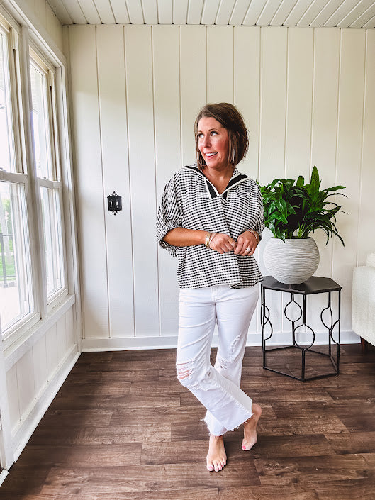 Lightweight black and white gingham dolman style top with mock neck, black and white striped V neck and elastic short sleeves.