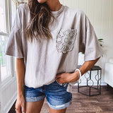 100% cotton faded tee with a crochet front pocket, split hem and oversized fit.