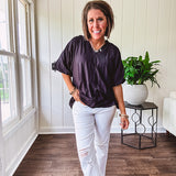 Lightweight, flowy V neck blouse with mock neck and puff short sleeves.