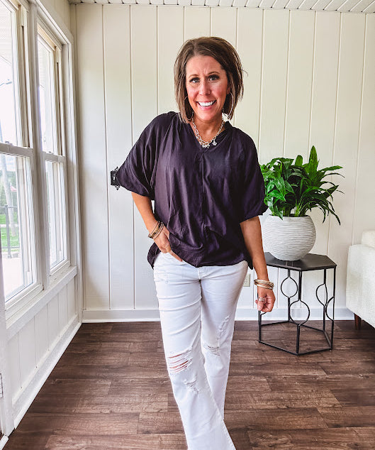 Lightweight, flowy V neck blouse with mock neck and puff short sleeves.