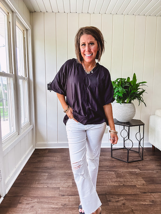 Lightweight, flowy V neck blouse with mock neck and puff short sleeves.