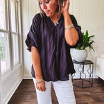Lightweight, flowy V neck blouse with mock neck and puff short sleeves.