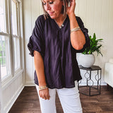 Lightweight, flowy V neck blouse with mock neck and puff short sleeves.