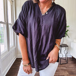 Lightweight, flowy V neck blouse with mock neck and puff short sleeves.