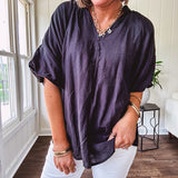 Lightweight, flowy V neck blouse with mock neck and puff short sleeves.