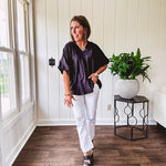 Lightweight, flowy V neck blouse with mock neck and puff short sleeves.