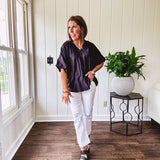 Lightweight, flowy V neck blouse with mock neck and puff short sleeves.