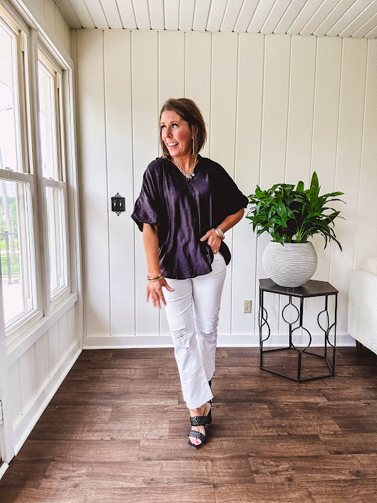 Lightweight, flowy V neck blouse with mock neck and puff short sleeves.