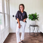 Lightweight, flowy V neck blouse with mock neck and puff short sleeves.