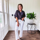 Lightweight, flowy V neck blouse with mock neck and puff short sleeves.