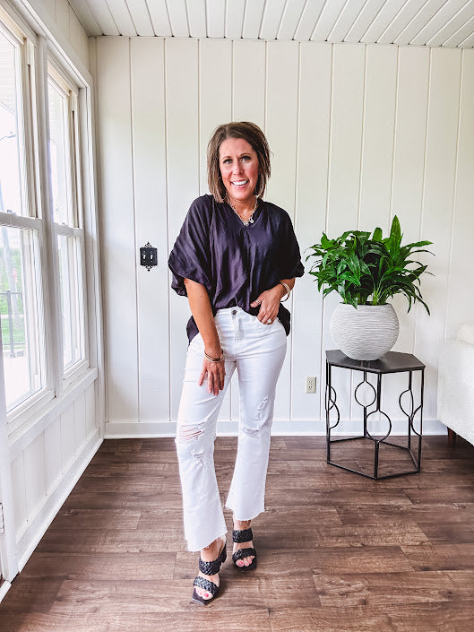 Lightweight, flowy V neck blouse with mock neck and puff short sleeves.