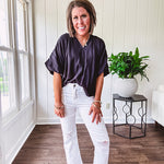 Lightweight, flowy V neck blouse with mock neck and puff short sleeves.
